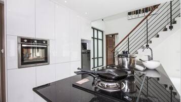 Villa | Private kitchen | Full-size fridge, microwave, oven, stovetop