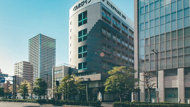 A modern building with a sign reading "Kuretake Inn". - Kuretake Inn Okayama (Okayama)