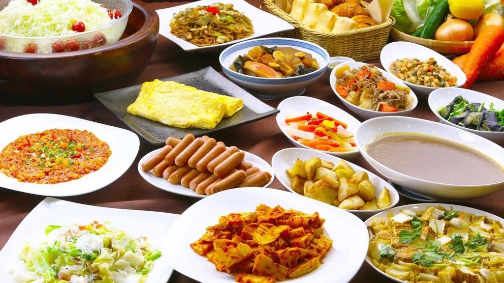 A variety of dishes and food items on a table.