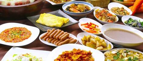 A variety of dishes and food items on a table.