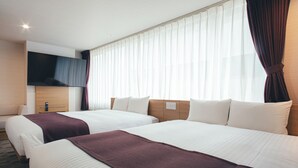 A hotel room with two beds, a flat-screen TV, and a large window with curtains. - Kuretake Inn Okayama (Okayama)
