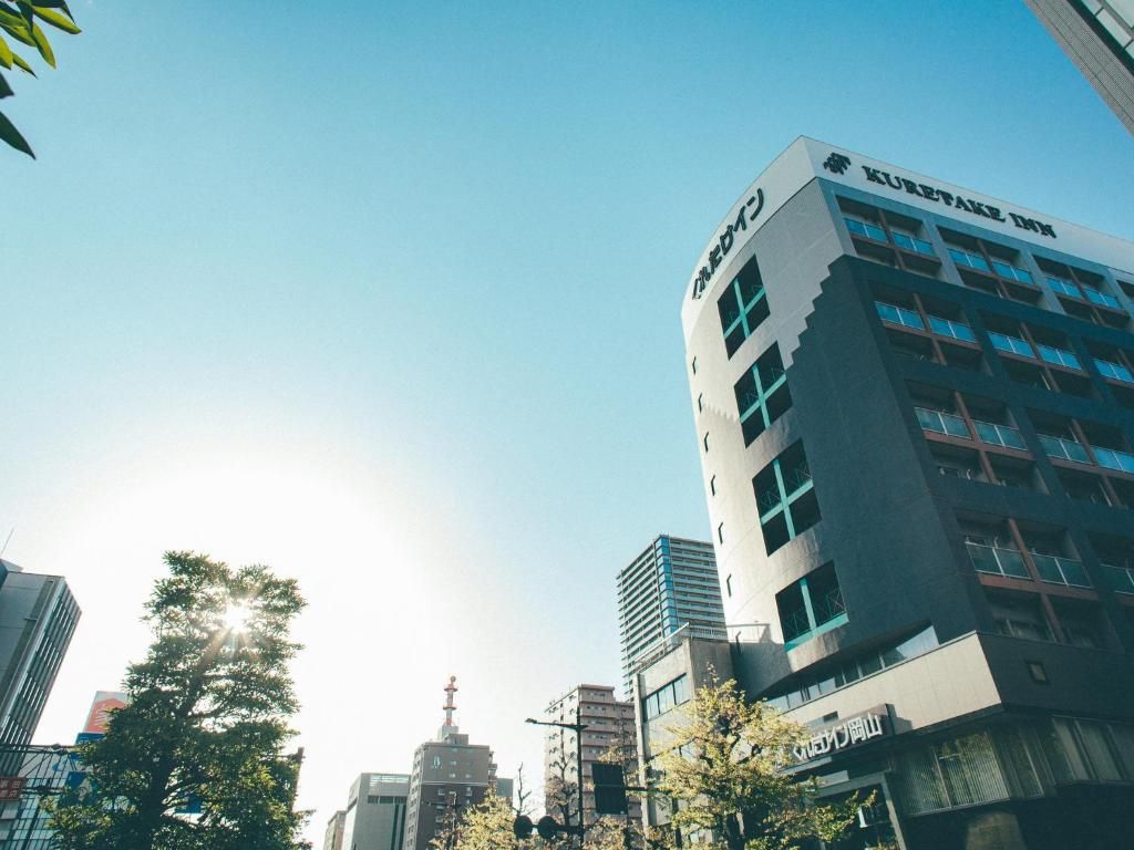 A modern building with the sign 'KURITAKE ZION' on the top.