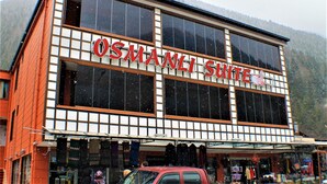 A building with a sign reading "OSMANLI SHITE". - Osmanli Suite (Çaykara)