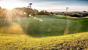 A golf course with a clear sky and sunlight. - Cintsa View (Great Kei)