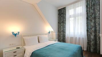 Habitació quàdruple familiar, 1 dormitori, cuina bàsica | 1 dormitori, llençols de cotó egipci i roba de llit d'alta qualitat