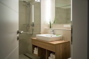 Shower, free toiletries, towels, toilet paper