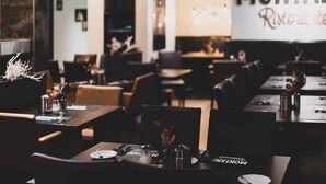 A restaurant interior with tables set for dining, a sign reading "MONTANA Ristorante," and a modern decor style. - Mountainpark Kassel (Kassel)