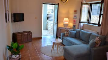 Deluxe appartement | Woonruimte | Een flatscreentelevisie