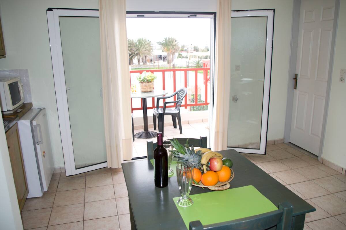 Apartment, Sea View | Living area | Flat-screen TV