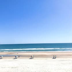 On the beach, sun-loungers, beach umbrellas, beach towels