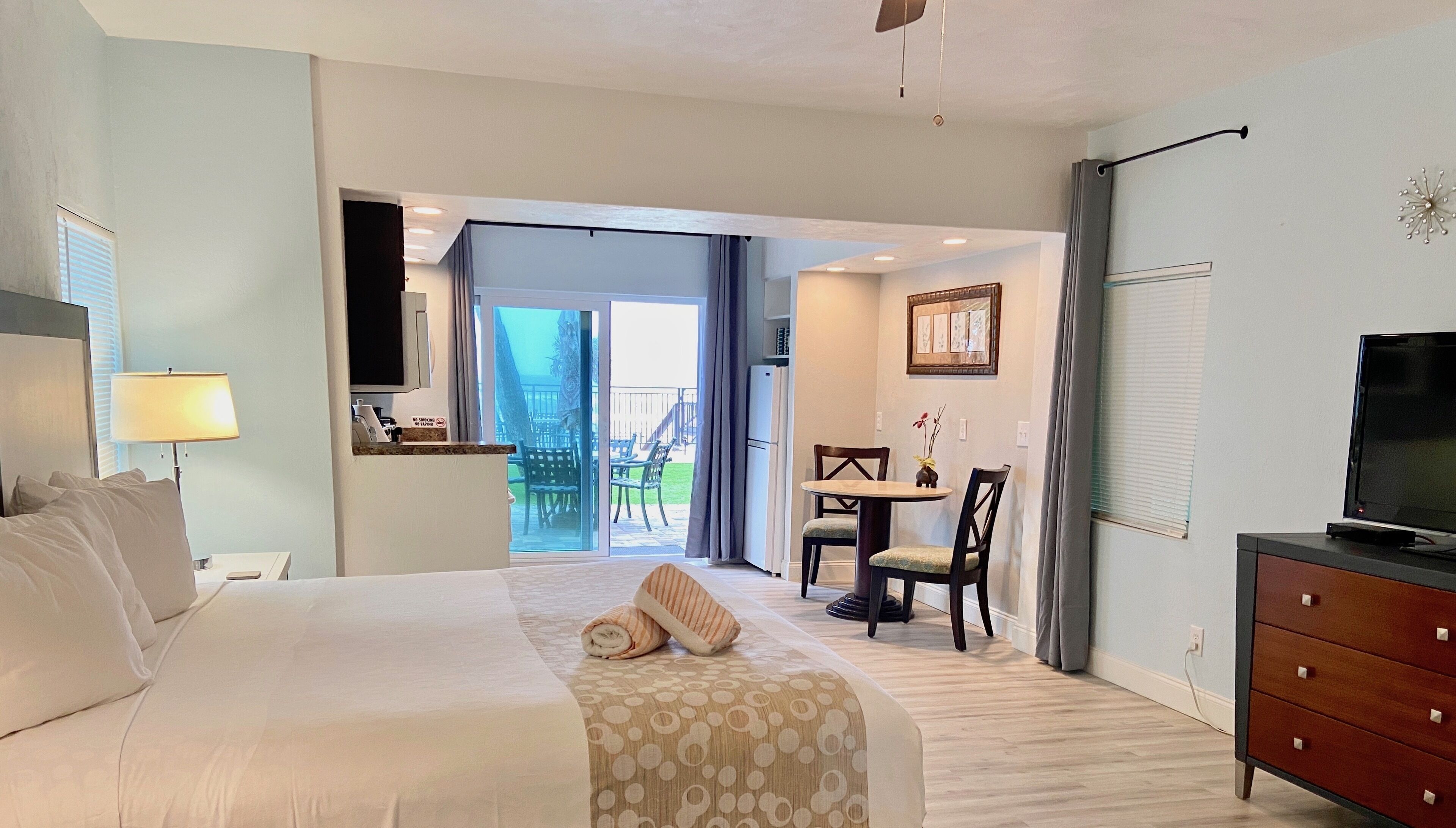 signature room, 1 king bed with sofa bed, ocean view | living area | 50-inch flat-screen tv with cable channels, tv