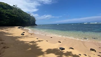 On the beach, sun-loungers, beach towels