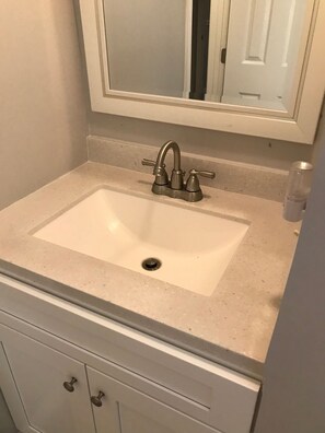 Combined shower/bathtub, hair dryer, towels, soap