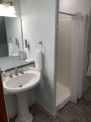 Combined shower/tub, hair dryer, towels, soap