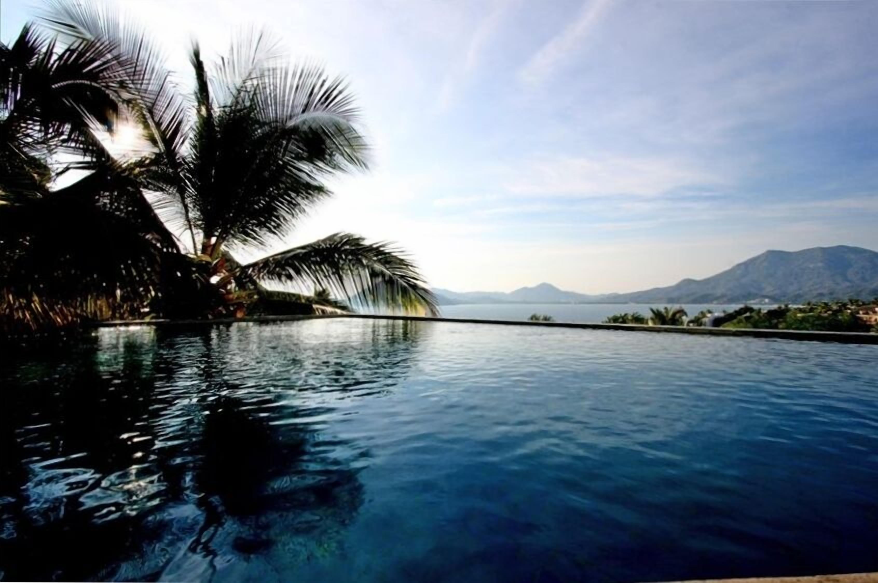 Infinity pool near sunset, overlooking Pacific Ocean (2 pools)