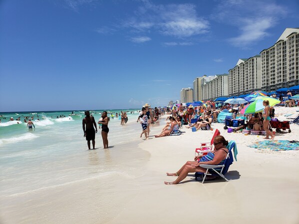 On the beach, sun-loungers