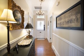 Welcoming hallway with antique lighting.