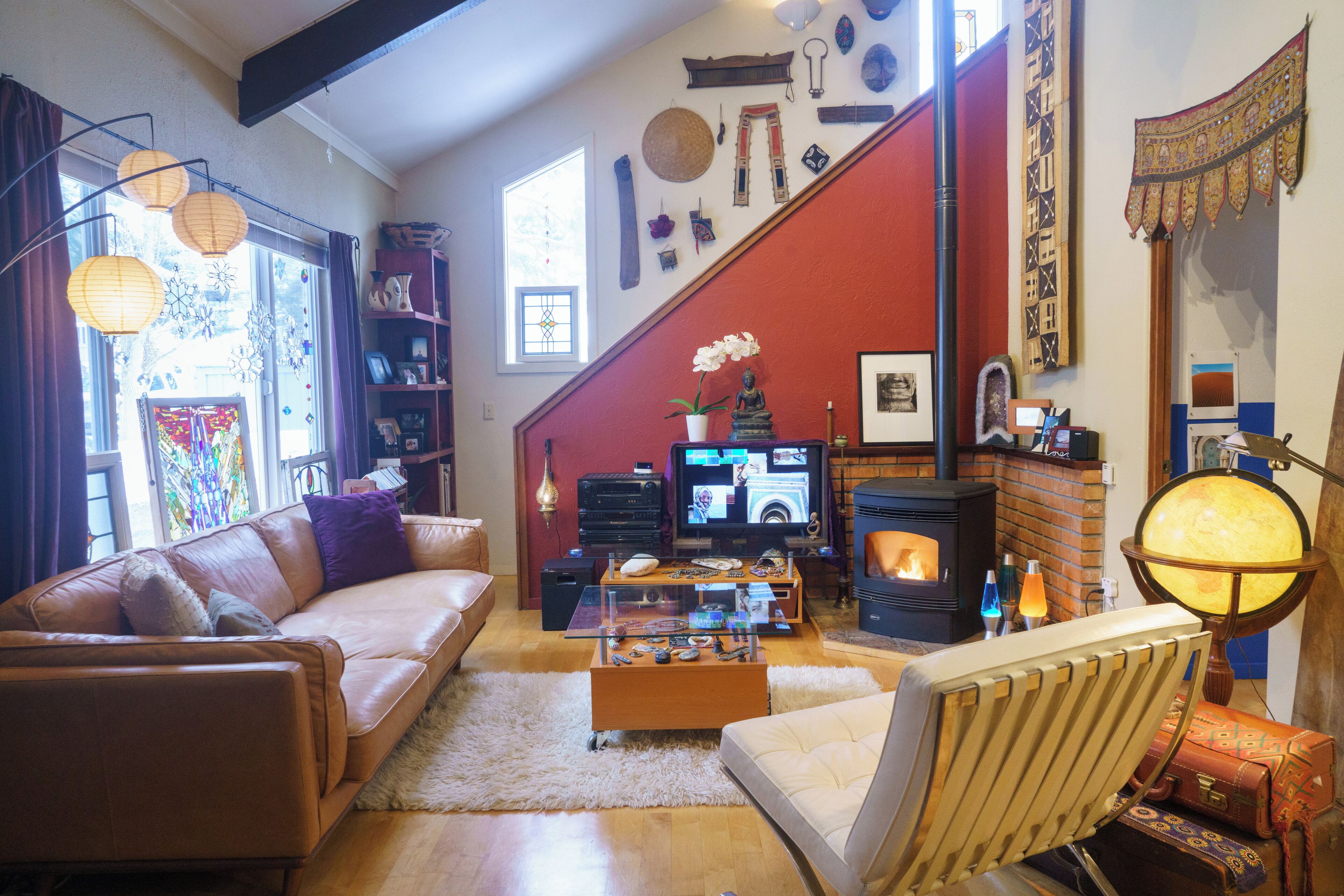 Living room with Apple TV, surround sound, pellet stove, all lighting on dimmers