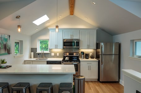 Fridge, microwave, oven, stovetop. New Stand Alone Private Backyard Cottage - A/C, Blocks to Zoo, Bus Line, Coffee