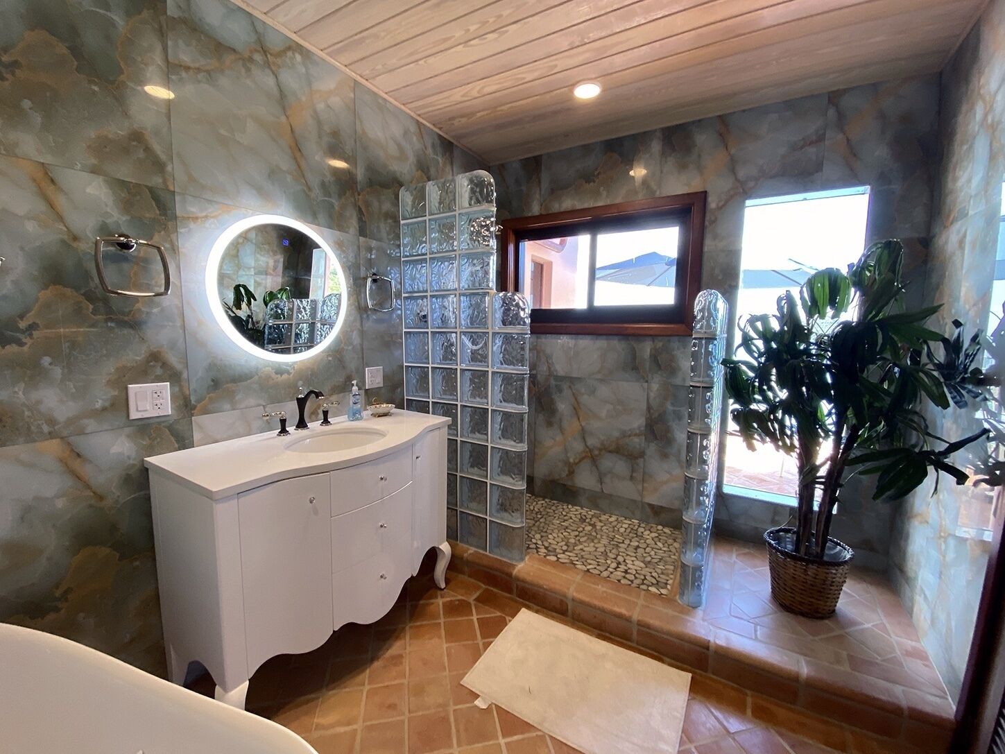 Bathtub, towels, soap, toilet paper