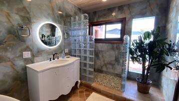 Bathtub, towels, soap, toilet paper