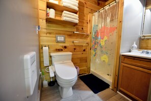 Shower, hair dryer, towels, toilet paper