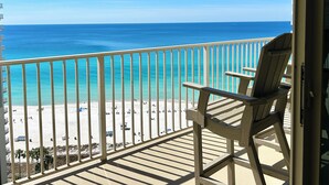 A balcony with a view of a beach and ocean. - 🌴 Rare Double Gulf View~Free Beach Chairs~No Resort Fee~2nd floor Front Parking (Panama City Beach)