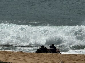 On the beach, sun loungers, beach towels