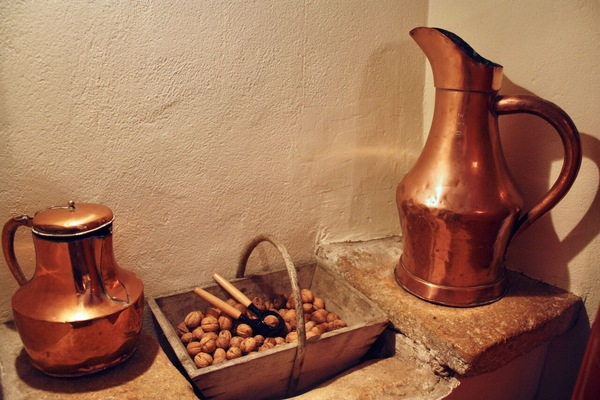 Original stone sink in the kitchen now holds the walnut basket
