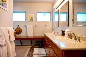 A bathroom with a sink, mirror, towel rack, and a window. - Magnificent!  Private Pool & Hot Tub - 180 degree Ocean Views (Kailua Kona)