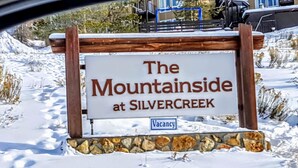 A sign for "The Mountainside at Silvercreek" with a 'Vacancy' label.