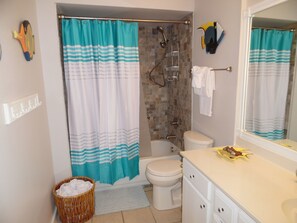 Combined shower/tub, towels, soap, shampoo