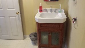 Bathtub, towels, soap, toilet paper