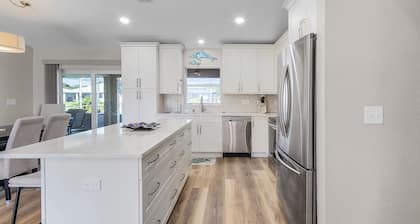 Peaceful fresh water canal home with heated pool. Incredible Value.