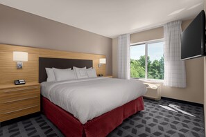 Premium bedding, pillow-top beds, desk, laptop workspace