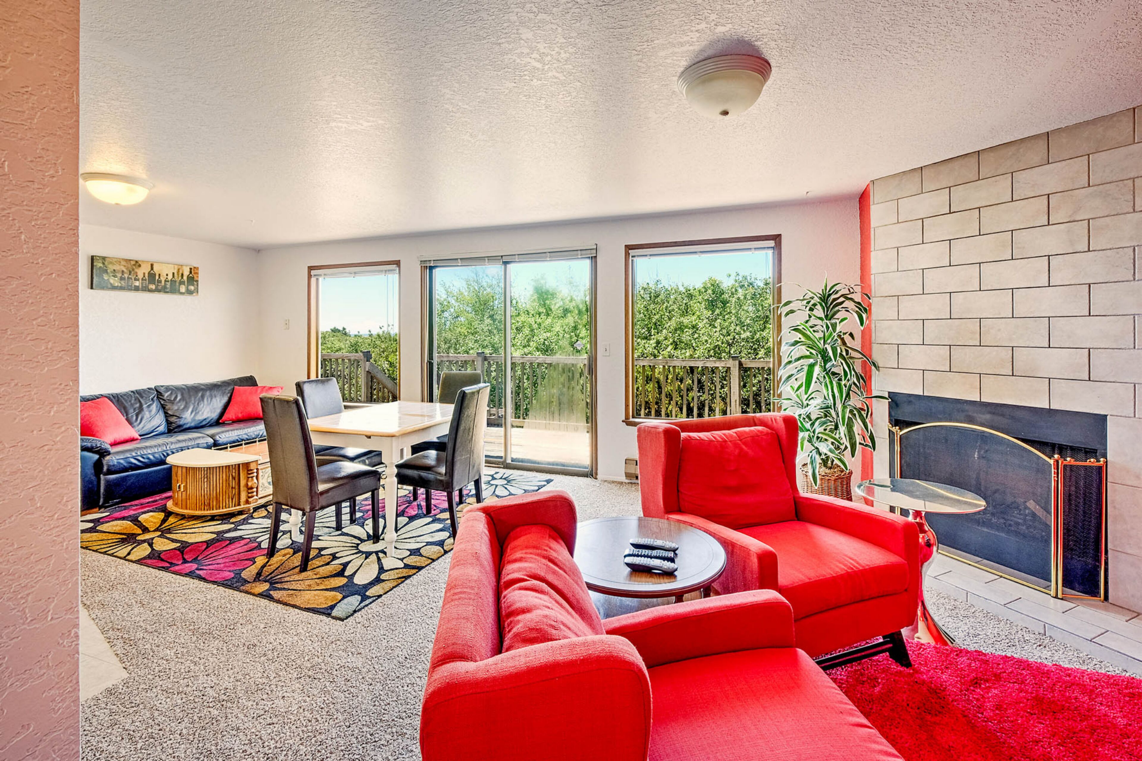 Family Condo, 1 Bedroom, Beach View, Beachfront | Living area | Flat-screen TV, fireplace