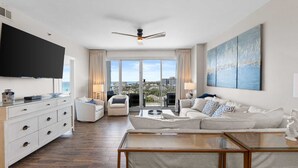 A modern living room with a sofa, coffee table, and TV. - 4 Bedroom/ 3 Bath With Amazing Views, You can Have It All! Modern Condo designed for comfort and Sty (Miramar Beach)