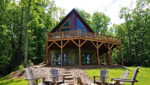 A cabin with a wooden deck and a fire pit surrounded by Adirondack chairs. - Near Wine Country & Parks. Great Hiking & Amazing Views! Reduced June rates! (Hays)