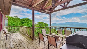A wooden deck with outdoor furniture, a grill, and a view of mountains and trees. - Multi-Million Dollar Mountain Estate-FOUR STATE VIEWS (Banner Elk)