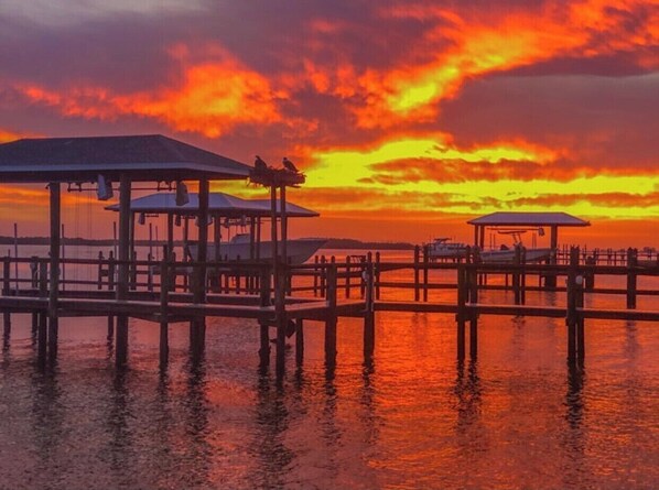 Enjoy serene waterfront views from the covered gazebos.