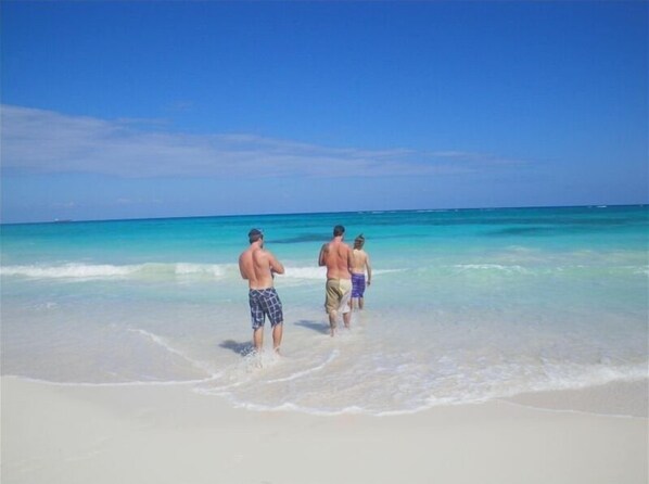 On the beach, sun loungers, beach towels