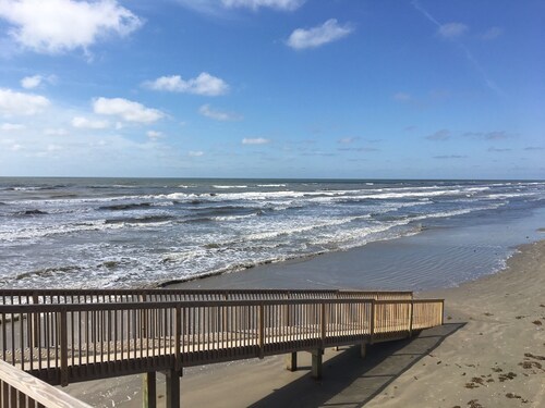 ON THE BEACH. Don't cross the busy highway with your family.  SEASCAPE 2103