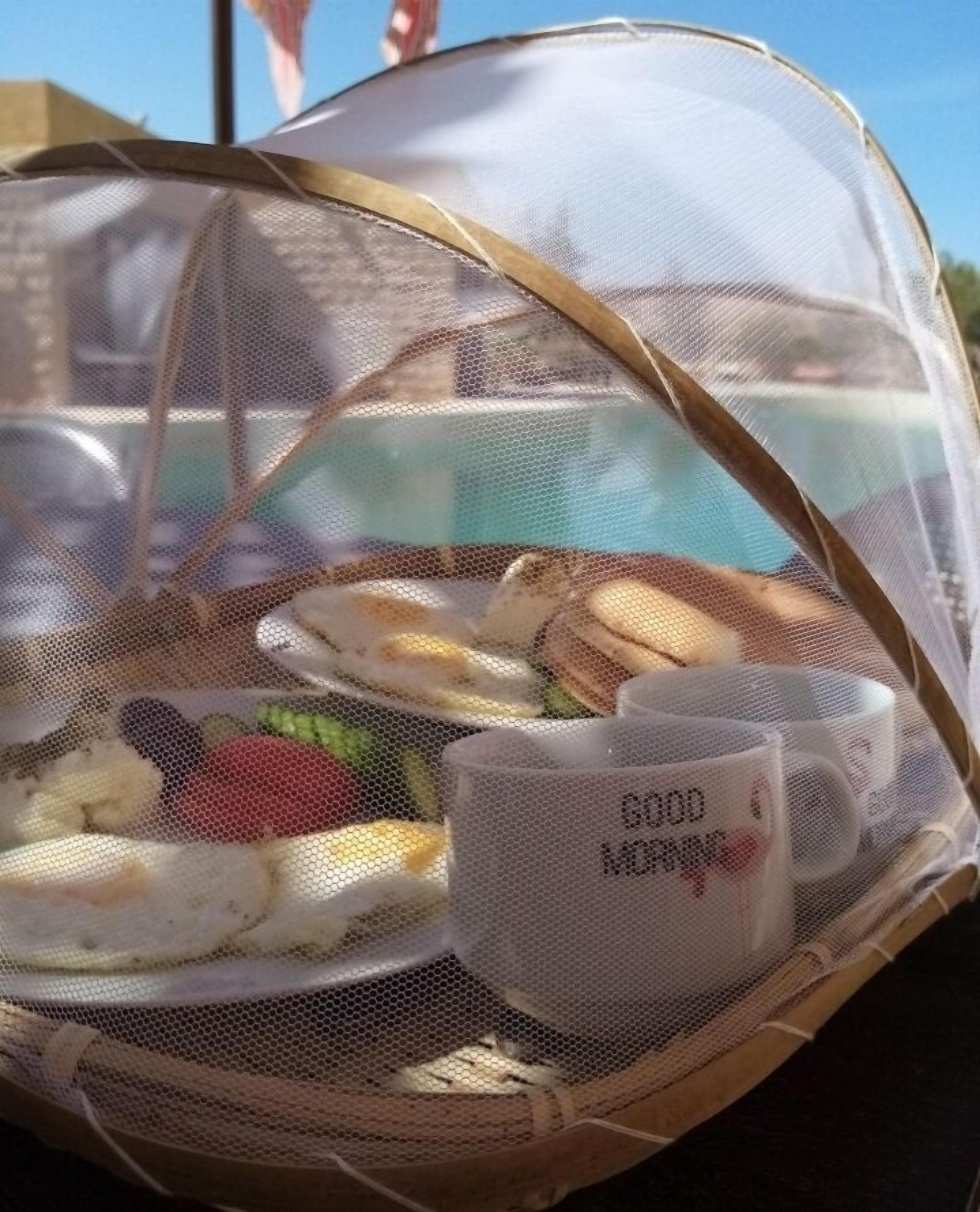 breakfast, lunch served; local and international cuisine, pool views