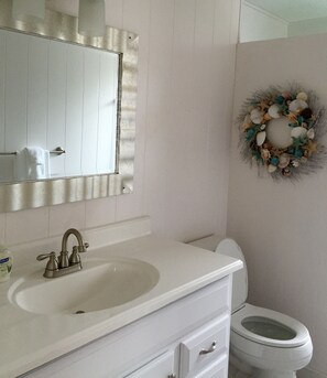 Shower, hair dryer, towels, toilet paper