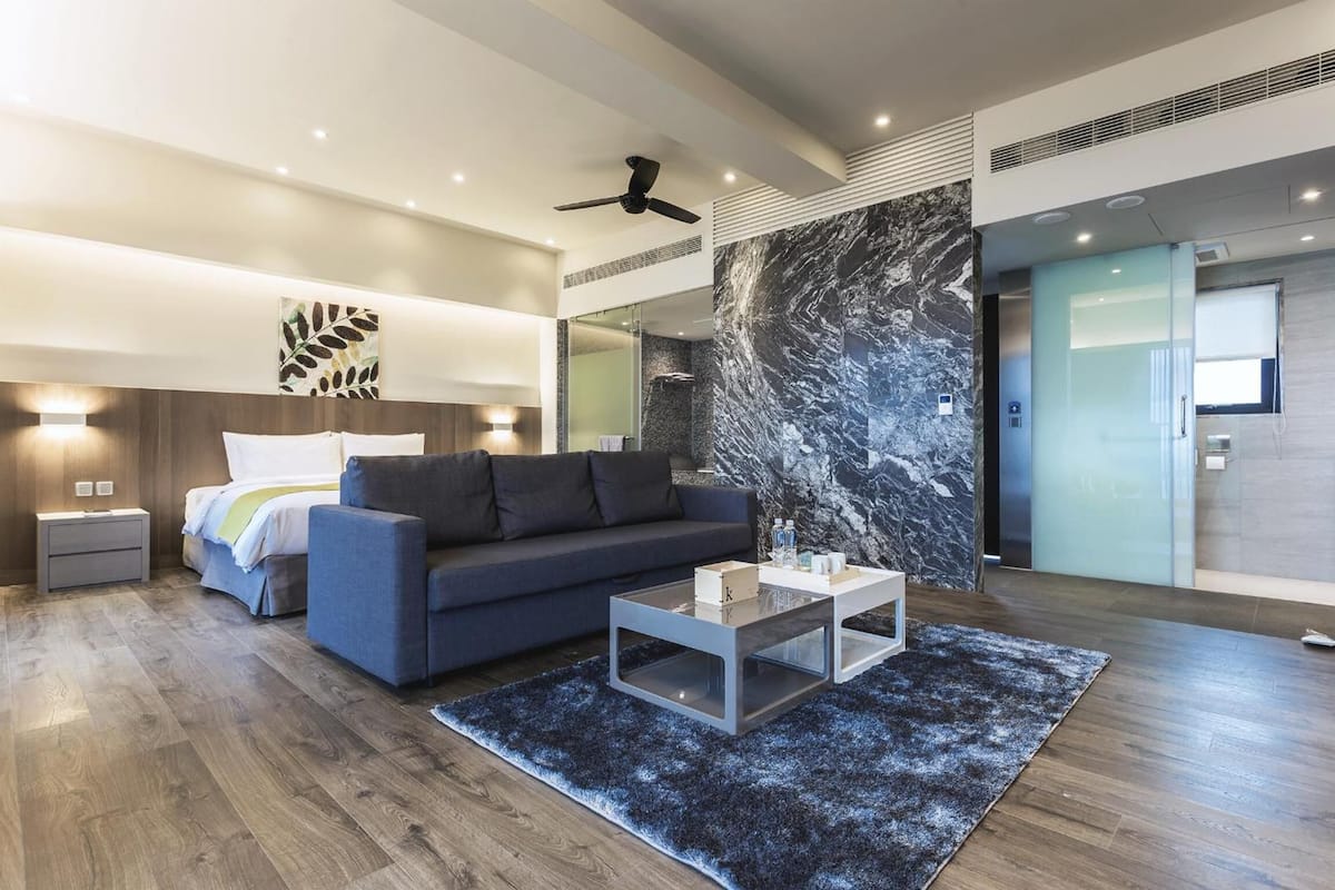 deluxe double room, ocean view | living room | 55-inch lcd tv with digital channels, tv