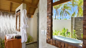 Separate tub and shower, rainfall showerhead, free toiletries