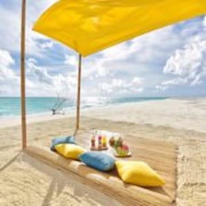 On the beach, white sand, sun loungers, beach towels