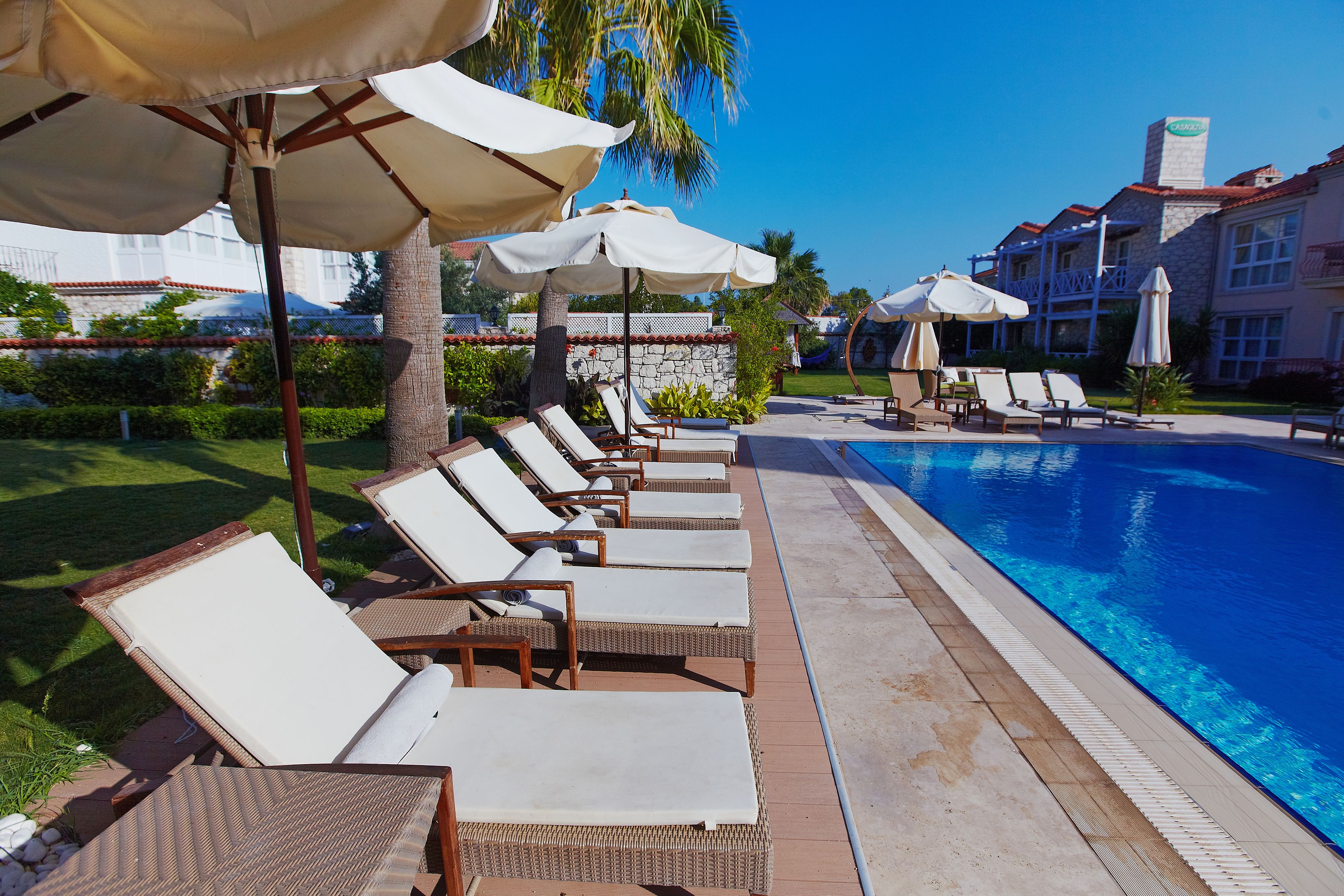 outdoor pool, pool umbrellas, pool loungers