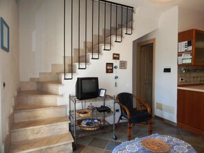 Apartment, 2 Bedrooms (Il Castello 1) | Living area | Flat-screen TV