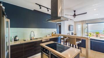 Fridge, stovetop, electric kettle, cookware/dishes/utensils